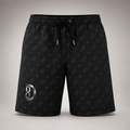 Model wearing the DOMIN8NY lined beach shorts, video preview