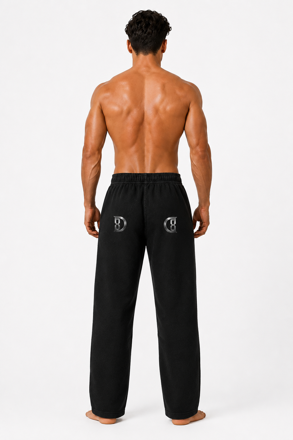 Model wearing the black DOMIN8NY Dragon straight-leg pants, alternate side view