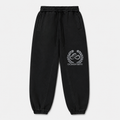 Model wearing the black DOMIN8NY Dragon fleece sweatpants, front view