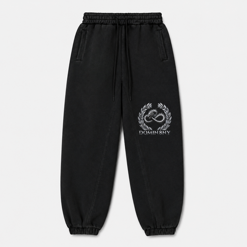 Model wearing the black DOMIN8NY Dragon fleece sweatpants, front view