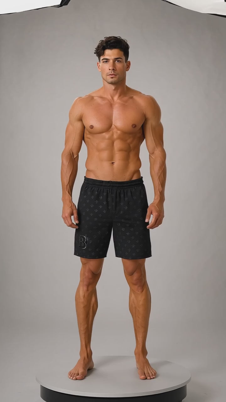 Model wearing the DOMIN8NY beach shorts, front view