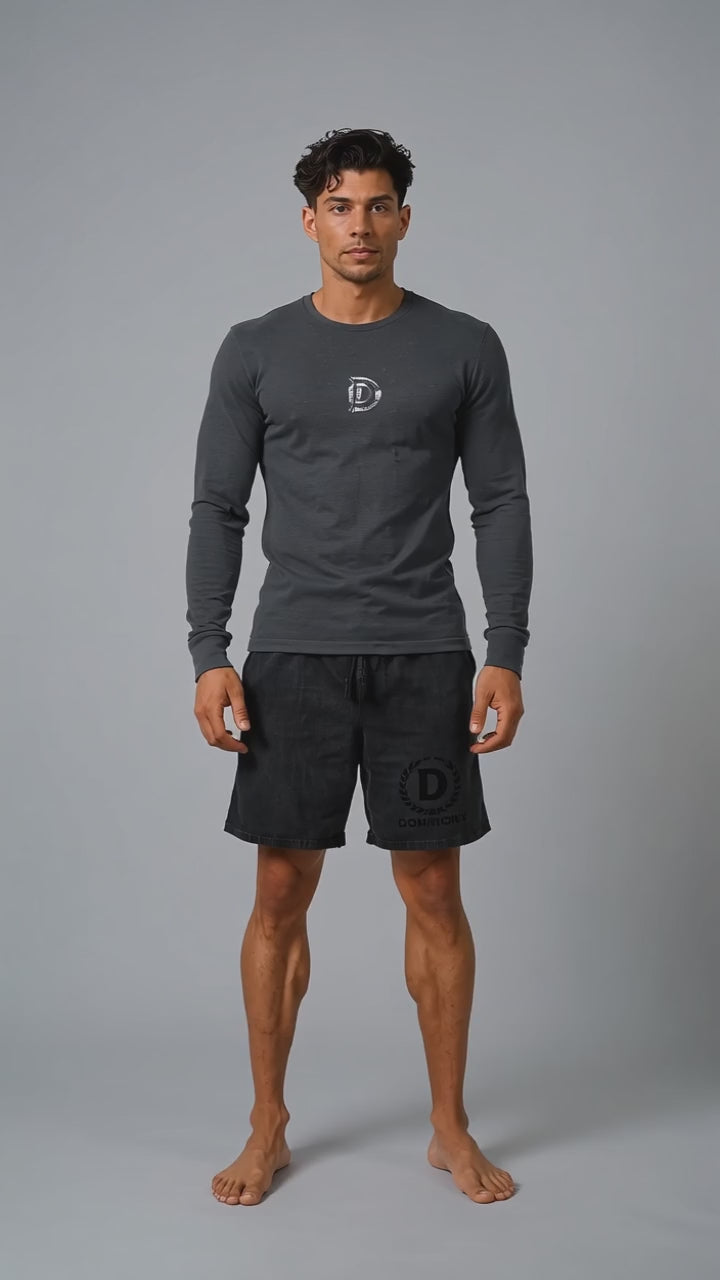 Model wearing the black DOMIN8NY Dragon long-sleeve T-shirt, front view