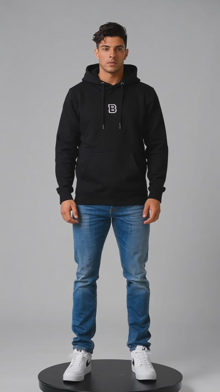 Model wearing the black DOMIN8NY Dragon fleece hoodie, front view