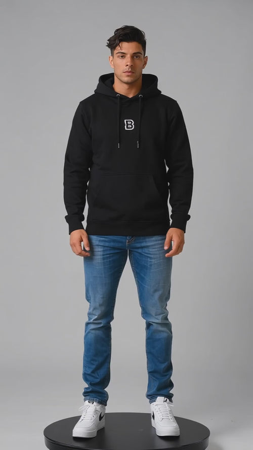 Model wearing the black DOMIN8NY Dragon fleece hoodie, front view
