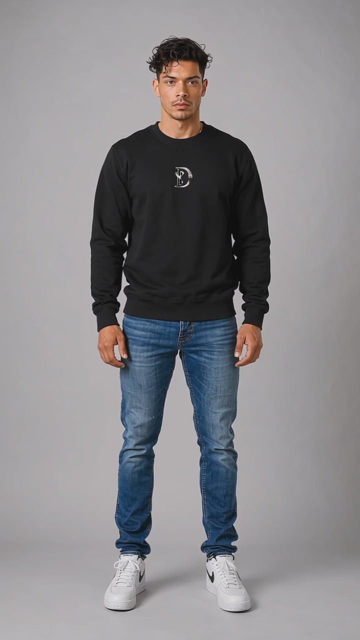 Model wearing the black DOMIN8NY Royal Flush graphic sweatshirt, front view