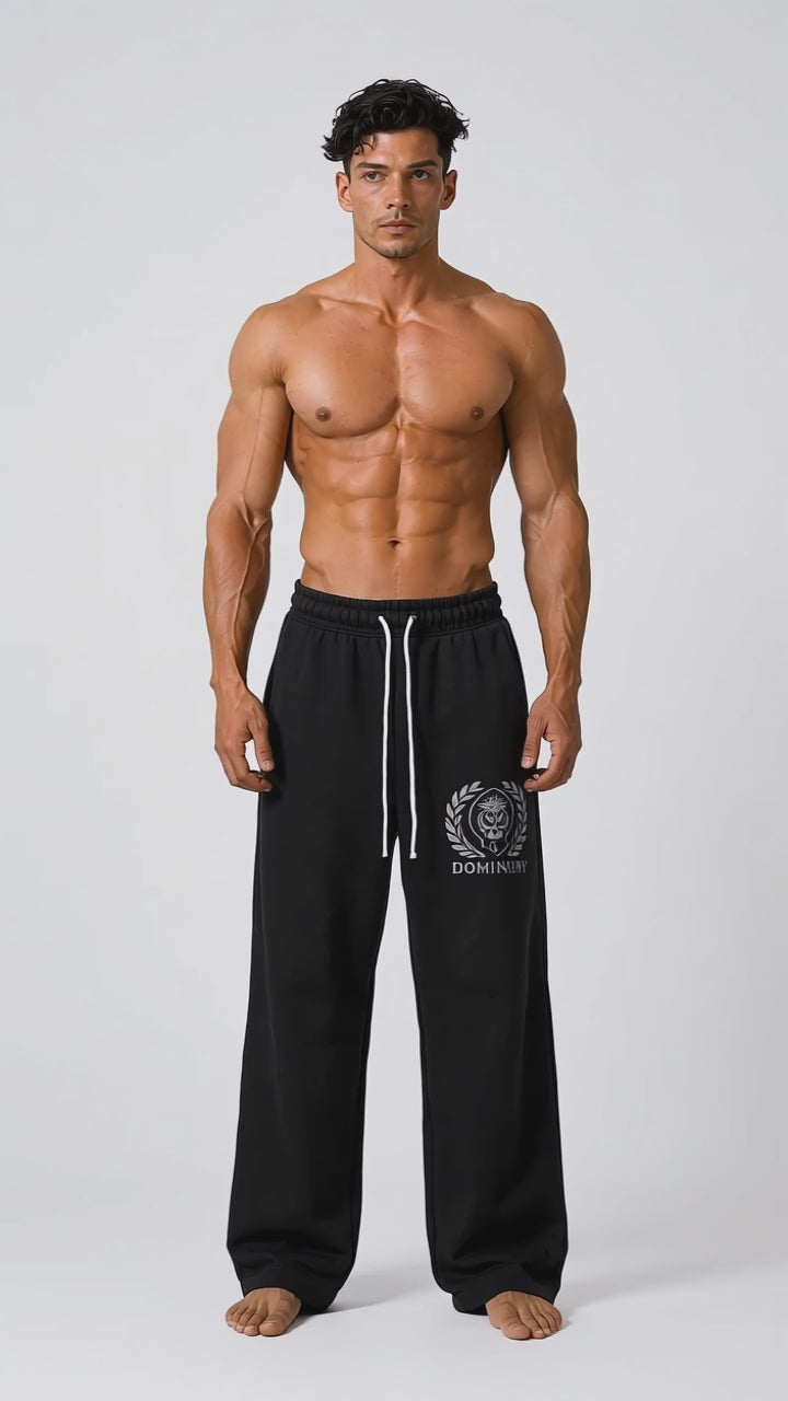 Model wearing the black DOMIN8NY Lion straight-leg pants, front view