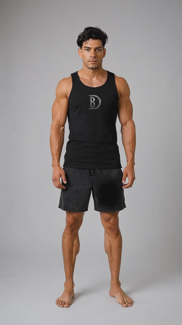 Model wearing the black DOMIN8NY Royal Flush graphic tank top, front view