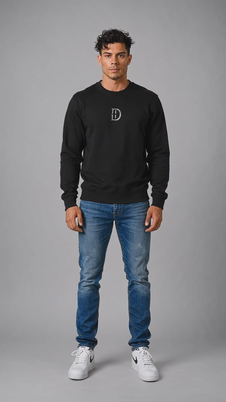 Model wearing the black DOMIN8NY Dragon graphic sweatshirt, front view