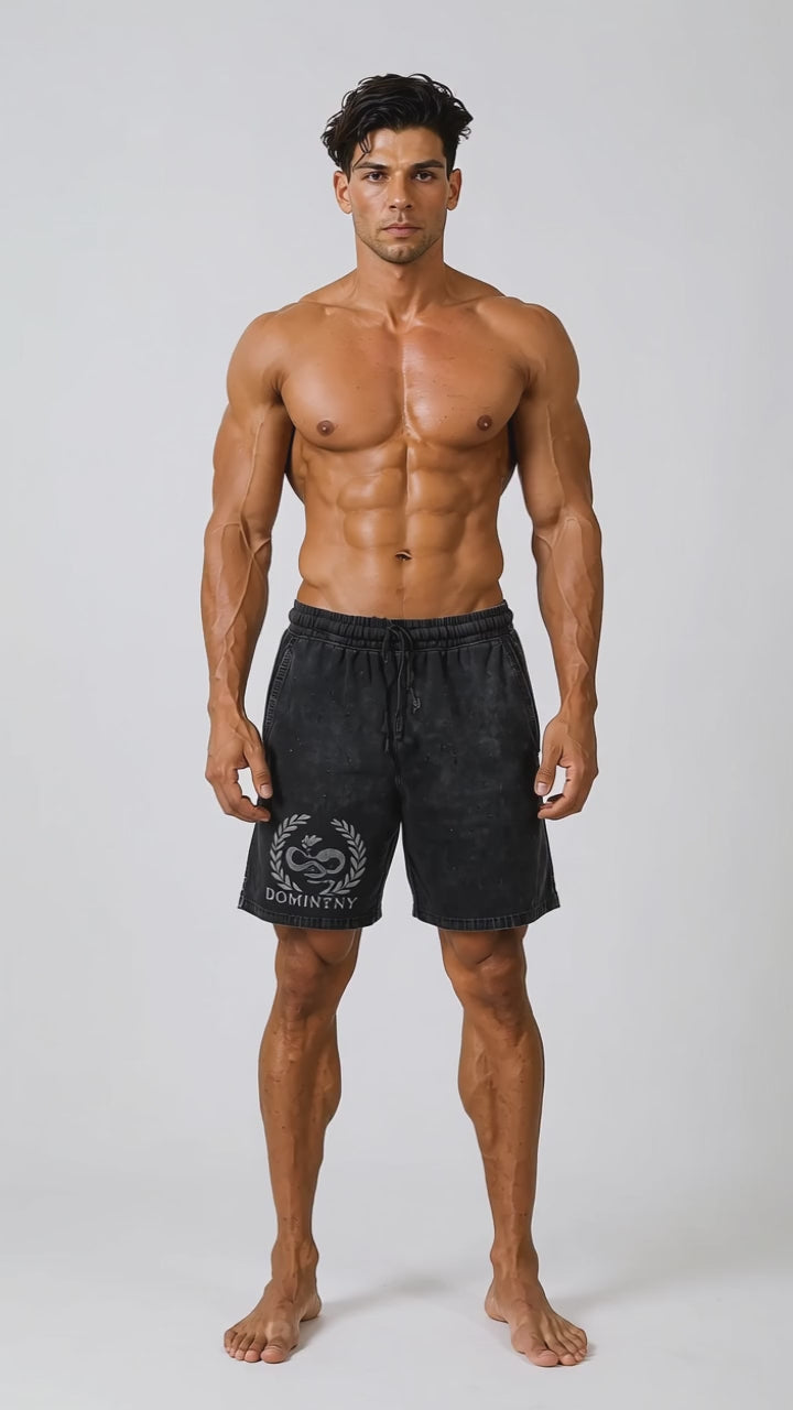 Model wearing the black DOMIN8NY Dragon vintage-wash shorts, front view