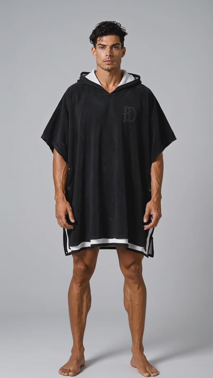 Model wearing the DOMIN8NY towel poncho, front view