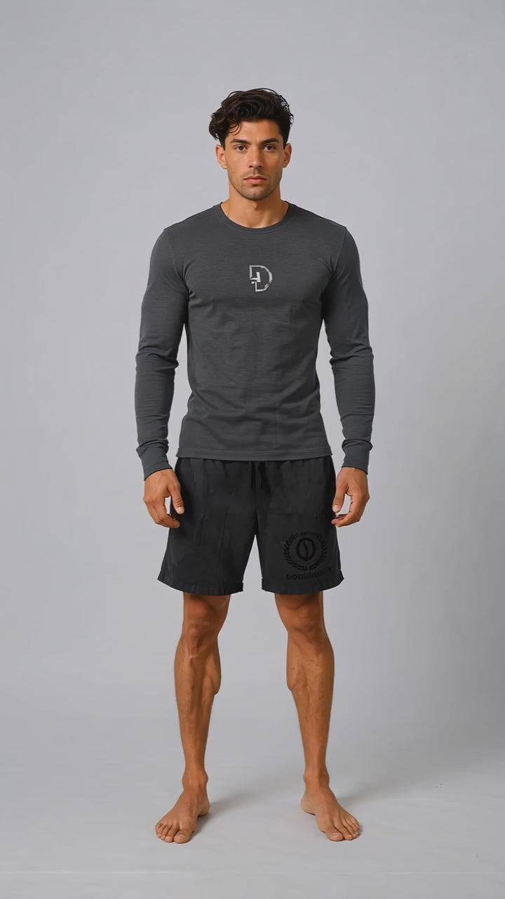 Model wearing the black DOMIN8NY Lion long-sleeve T-shirt, front view