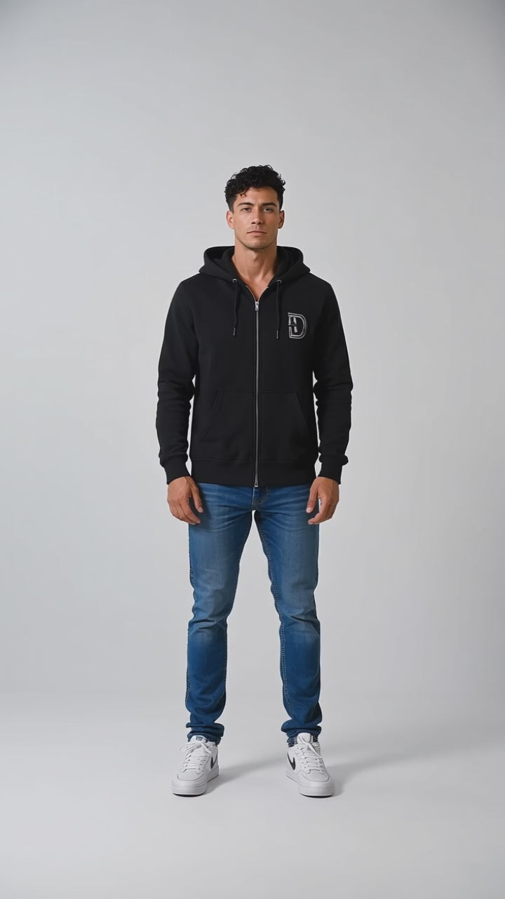 Model wearing the black DOMIN8NY Dragon zip-up hoodie, front view